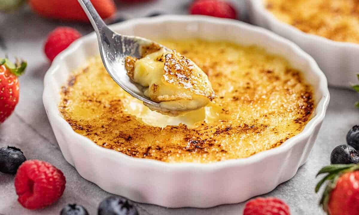 Creme Brulee in ramekin with spoonful taken out