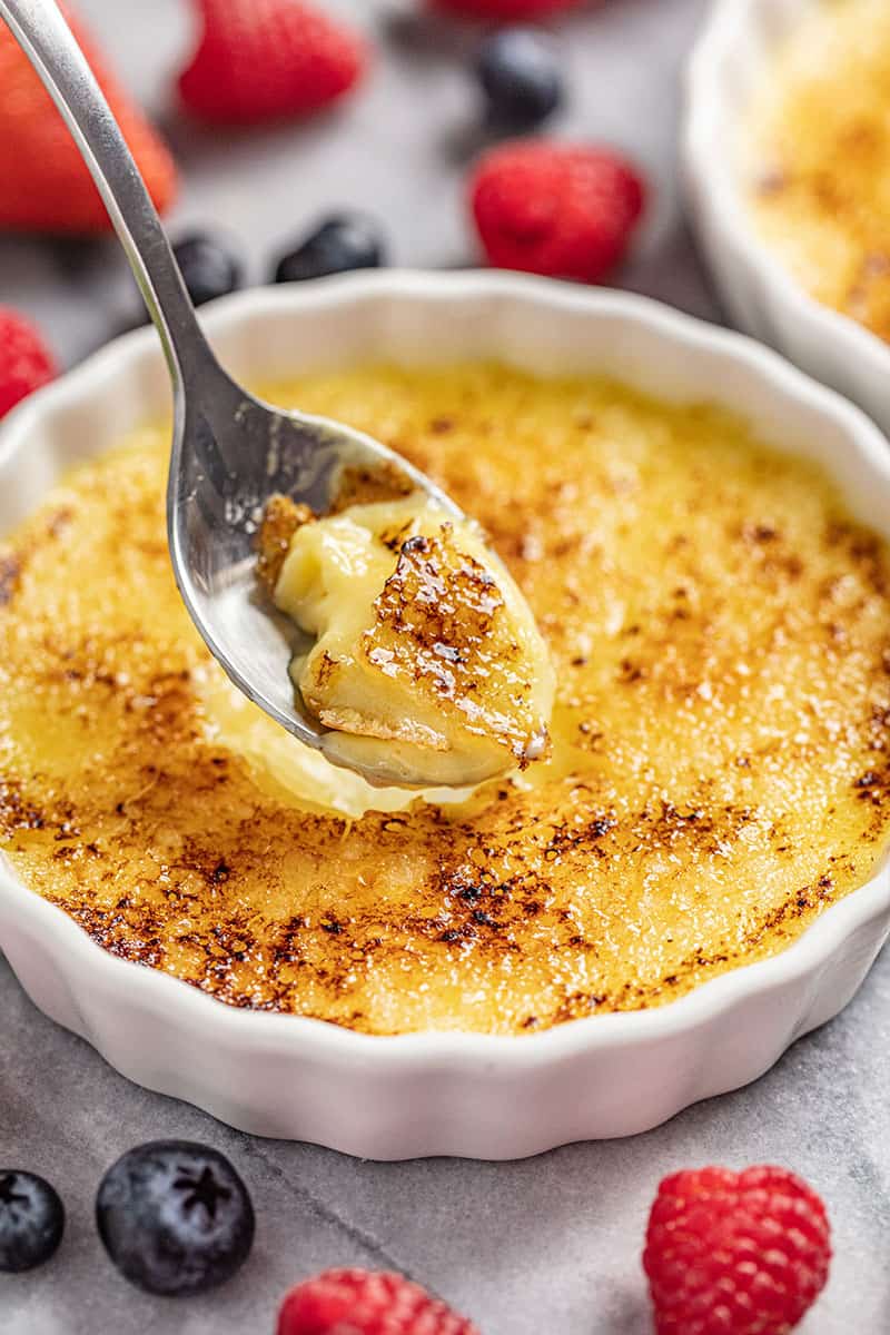 Creme Brulee in ramekin with spoonful taken out